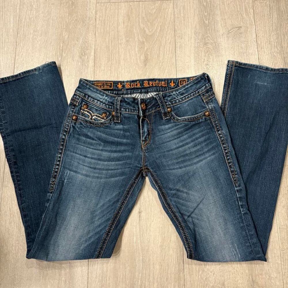 Rock Revival low rise boot cut jeans. In 29” has sequins